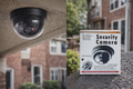 Dome dummy security camera with flashing LED installed as a visual security deterrent