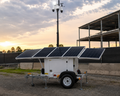 Montavue solar-powered mobile security trailer with surveillance mast and solar panels for remote site monitoring