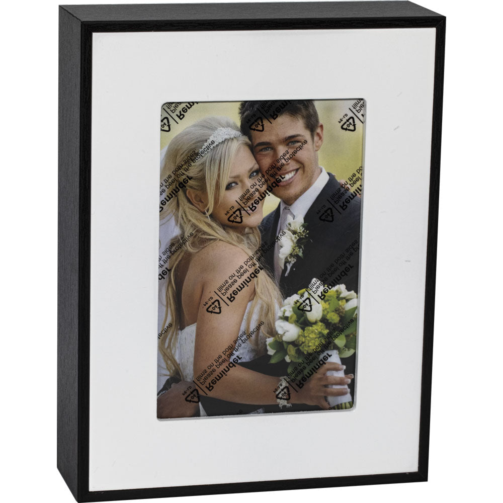 Black photo frame diversion safe with white mat and sample photograph.