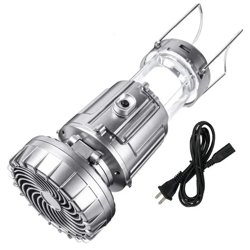 Silver portable lantern and fan with carrying handles and charging cable.